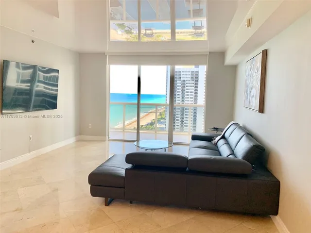 a living room with furniture window and couch
