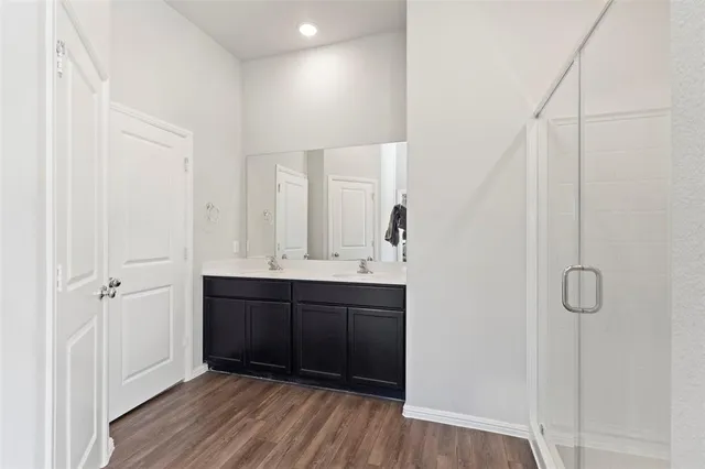 a bathroom with a sink and mirror