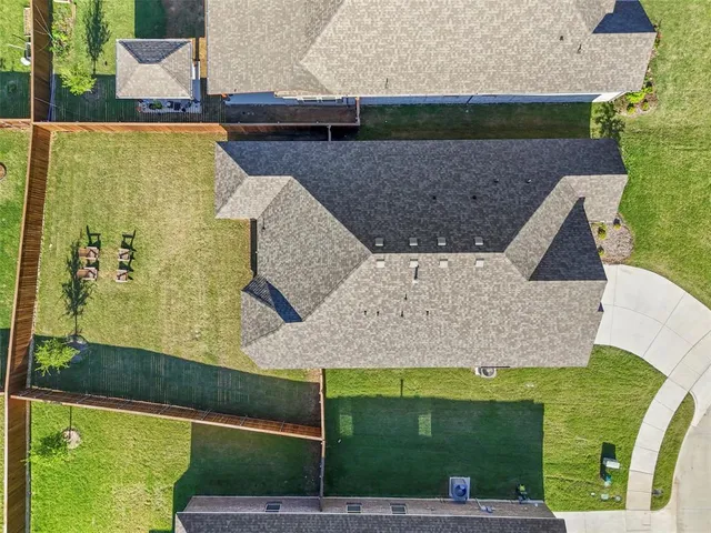 an aerial view of a house with swimming pool