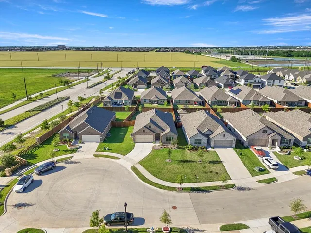 a view of a swimming pool with an outdoor seating