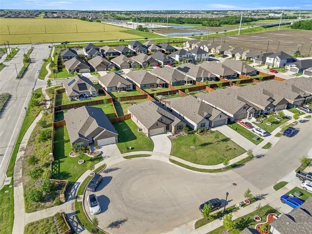 an aerial view of a house with a ocean view