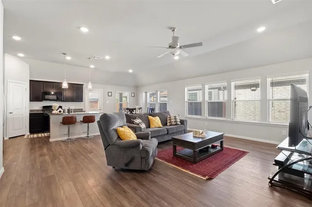 a living room with furniture fireplace and flat screen tv