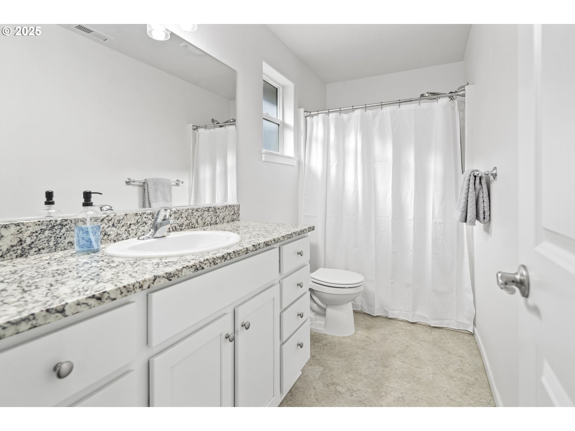 1871 Southeast Academy Street Dallas, OR 97338 - Photo 14 of 24 a bathroom with a granite countertop sink a toilet and a shower