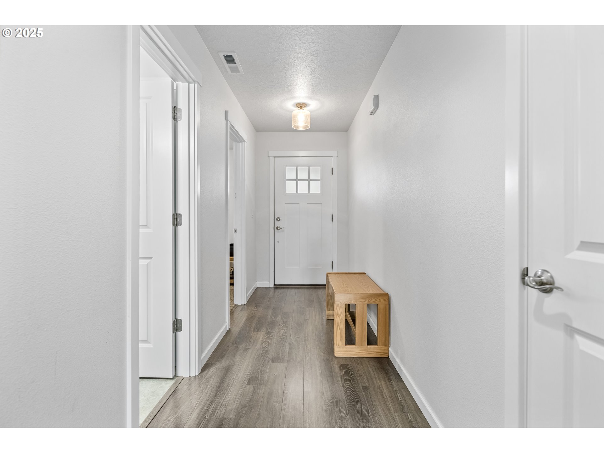 1871 Southeast Academy Street Dallas, OR 97338 - Photo 3 of 24 a view of hallway with wooden floor