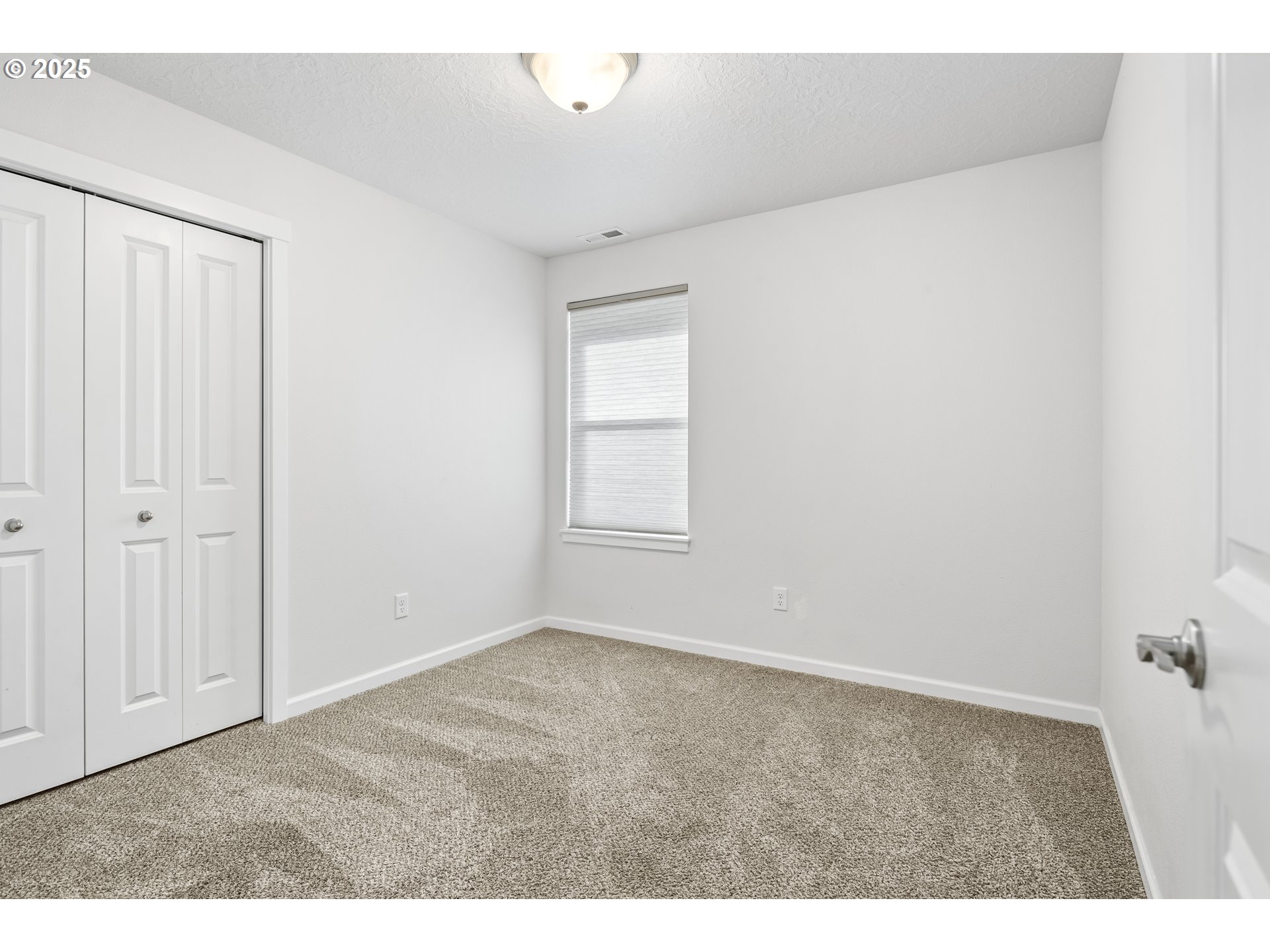 1871 Southeast Academy Street Dallas, OR 97338 - Photo 5 of 24 a view of an empty room with a window
