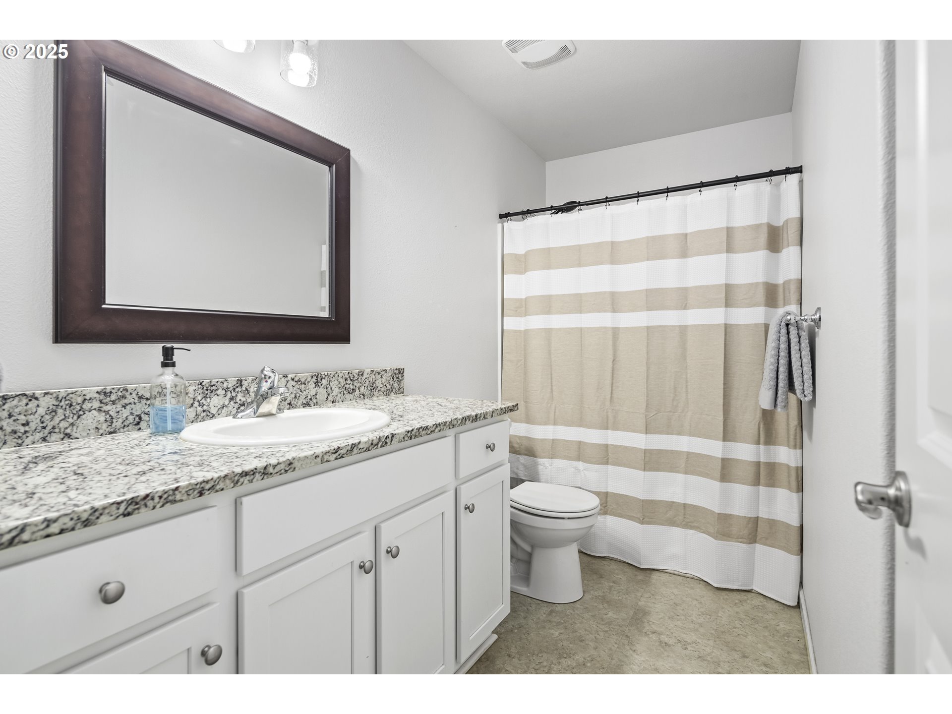 1871 Southeast Academy Street Dallas, OR 97338 - Photo 6 of 24 a bathroom with a granite countertop sink toilet and shower