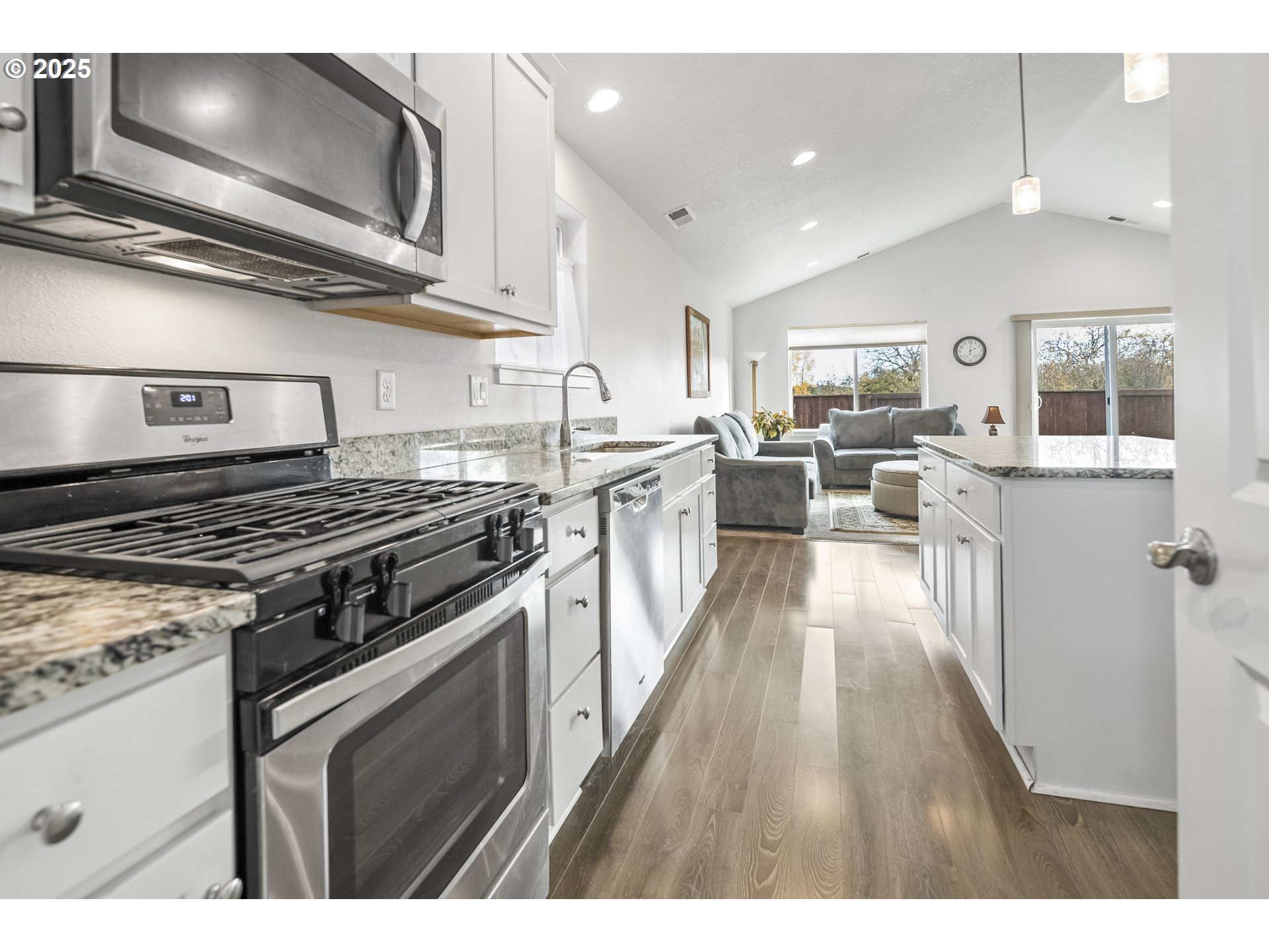 1871 Southeast Academy Street Dallas, OR 97338 - Photo 9 of 24 a kitchen with stainless steel appliances granite countertop a stove top oven a sink dishwasher and white cabinets