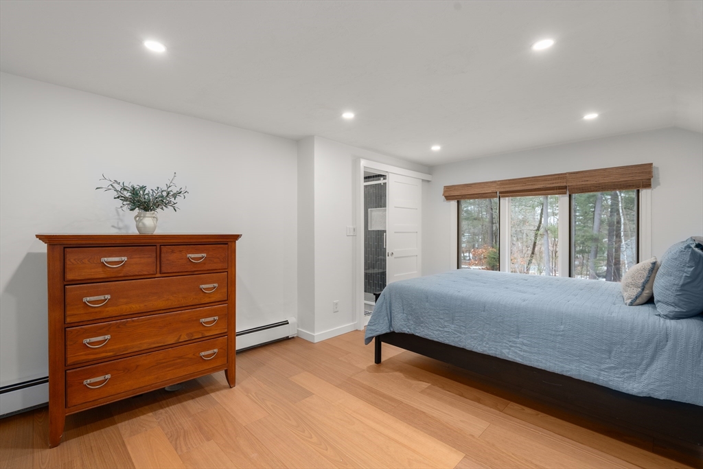15 Adams Road Sudbury, MA 01776 - Photo 17 of 41 a bedroom with a bed and a dresser