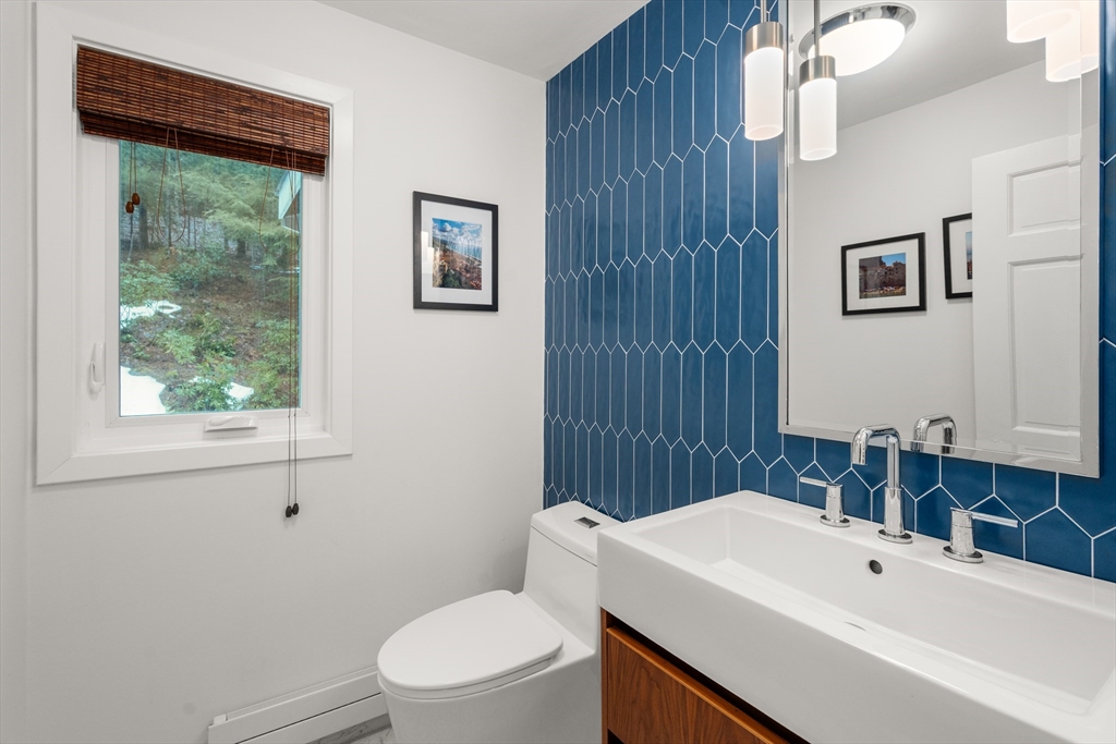15 Adams Road Sudbury, MA 01776 - Photo 18 of 41 a bathroom with a sink a toilet and shower