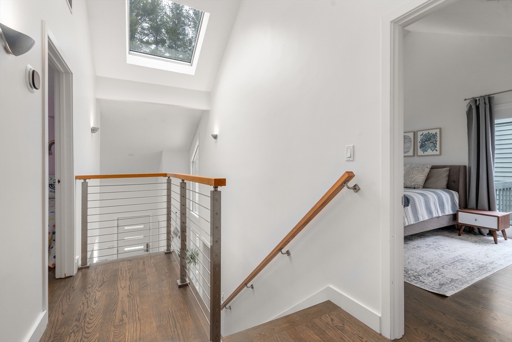 15 Adams Road Sudbury, MA 01776 - Photo 22 of 41 a view of a hallway to a livingroom with furniture