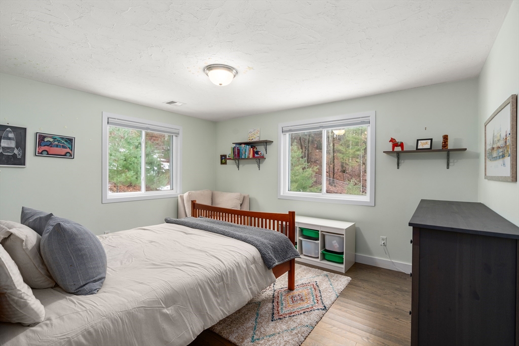 15 Adams Road Sudbury, MA 01776 - Photo 26 of 41 a bedroom with a bed and a window