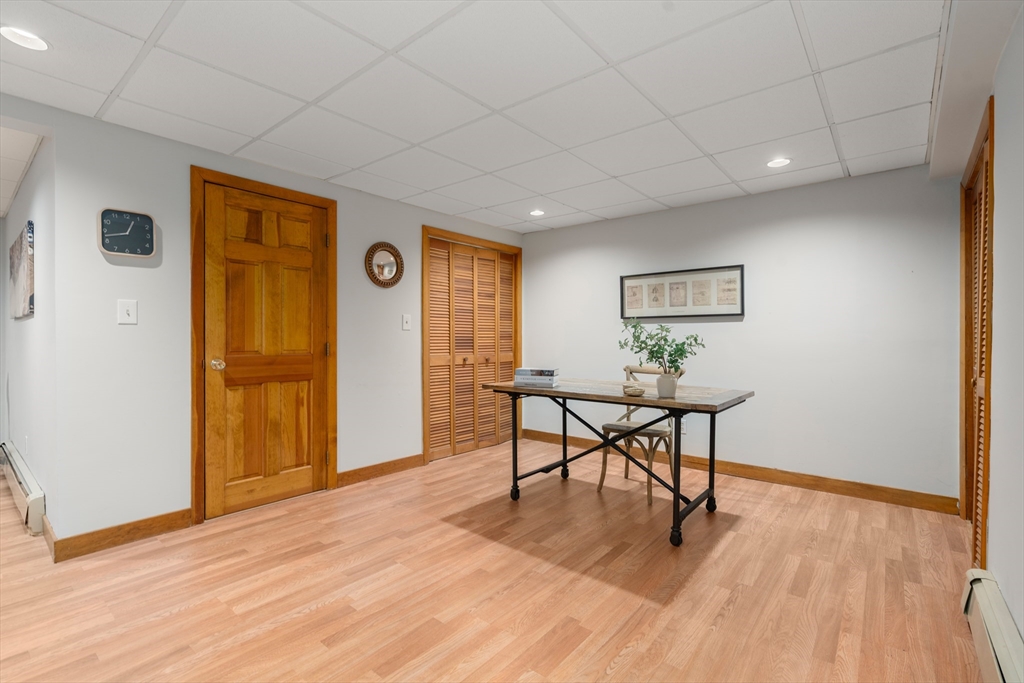 15 Adams Road Sudbury, MA 01776 - Photo 27 of 41 a view of a livingroom with furniture wooden floor and window