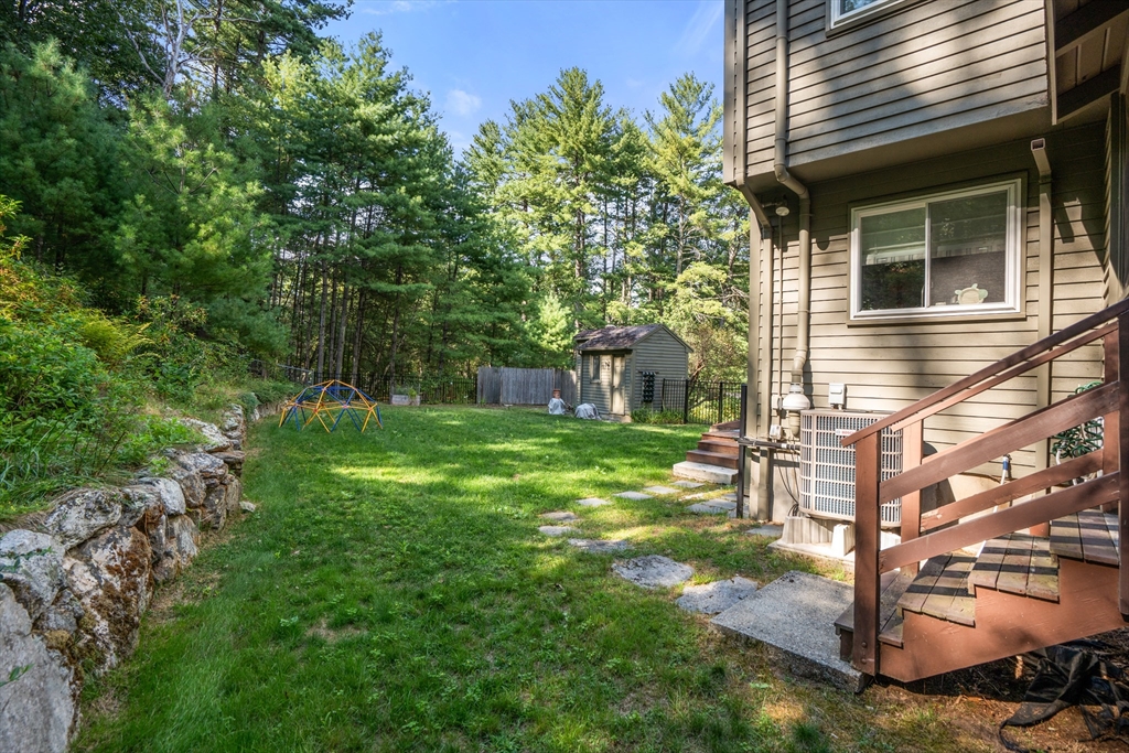 15 Adams Road Sudbury, MA 01776 - Photo 30 of 41 a view of a house with a backyard