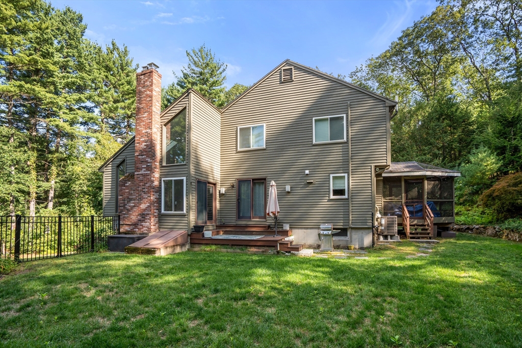 15 Adams Road Sudbury, MA 01776 - Photo 33 of 41 a front view of house with yard and outdoor seating
