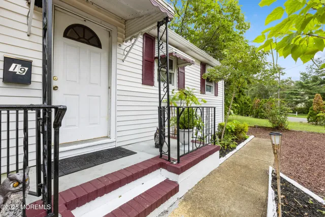 a front view of a house with a porch