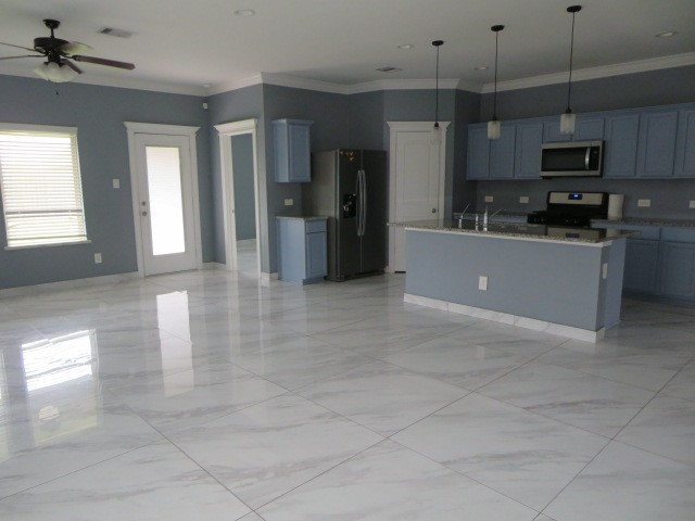 23210 Barberry Crk Trail Spring, TX 77373 - Photo 33 of 33 a large kitchen with cabinets and stainless steel appliances
