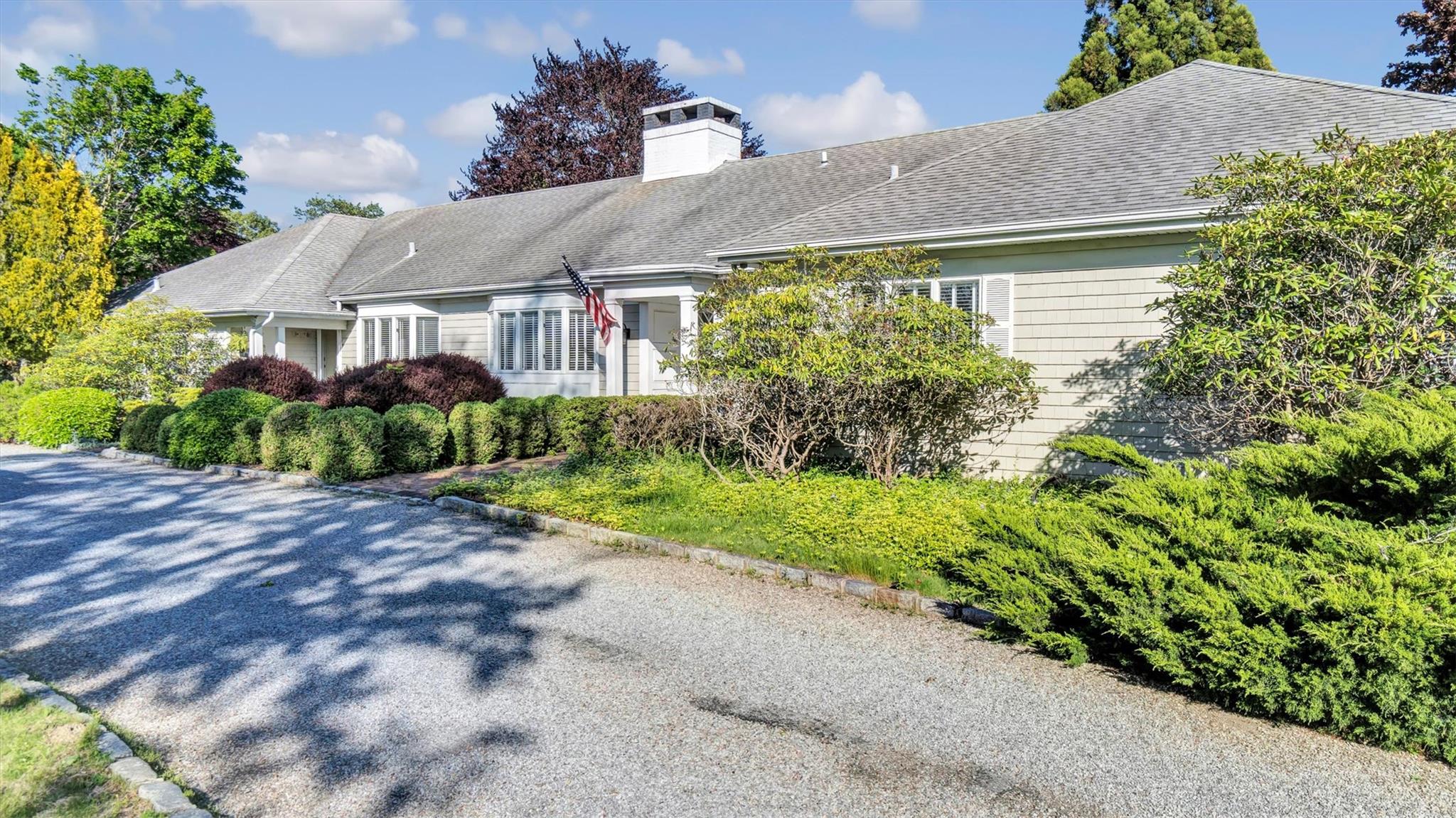 17 Oneck Road Westhampton Beach, NY 11978 - Photo 1 of 1 View of property exterior featuring roof with shingles and a chimney
