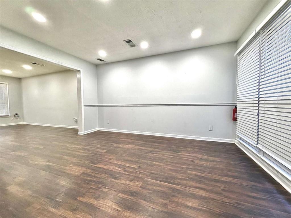 4129 Boxwood Way Duluth, GA 30096 - Photo 11 of 27 an empty room with wooden floor and windows