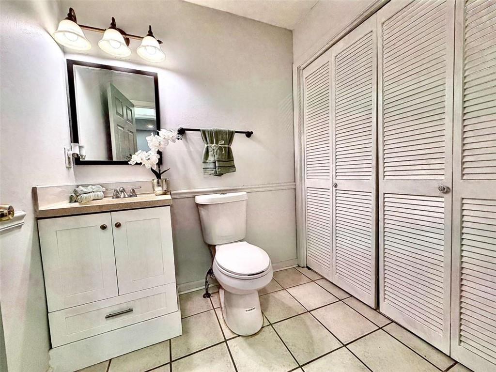 4129 Boxwood Way Duluth, GA 30096 - Photo 13 of 27 a bathroom with a toilet sink and mirror