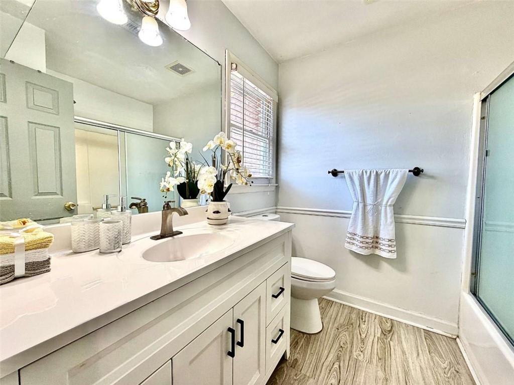 4129 Boxwood Way Duluth, GA 30096 - Photo 17 of 27 a bathroom with a double vanity sink and a mirror