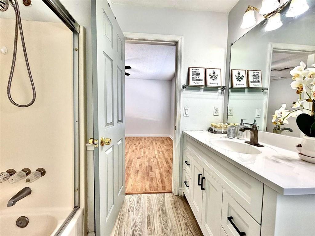 4129 Boxwood Way Duluth, GA 30096 - Photo 18 of 27 a spacious bathroom with a double vanity sink a mirror and shower