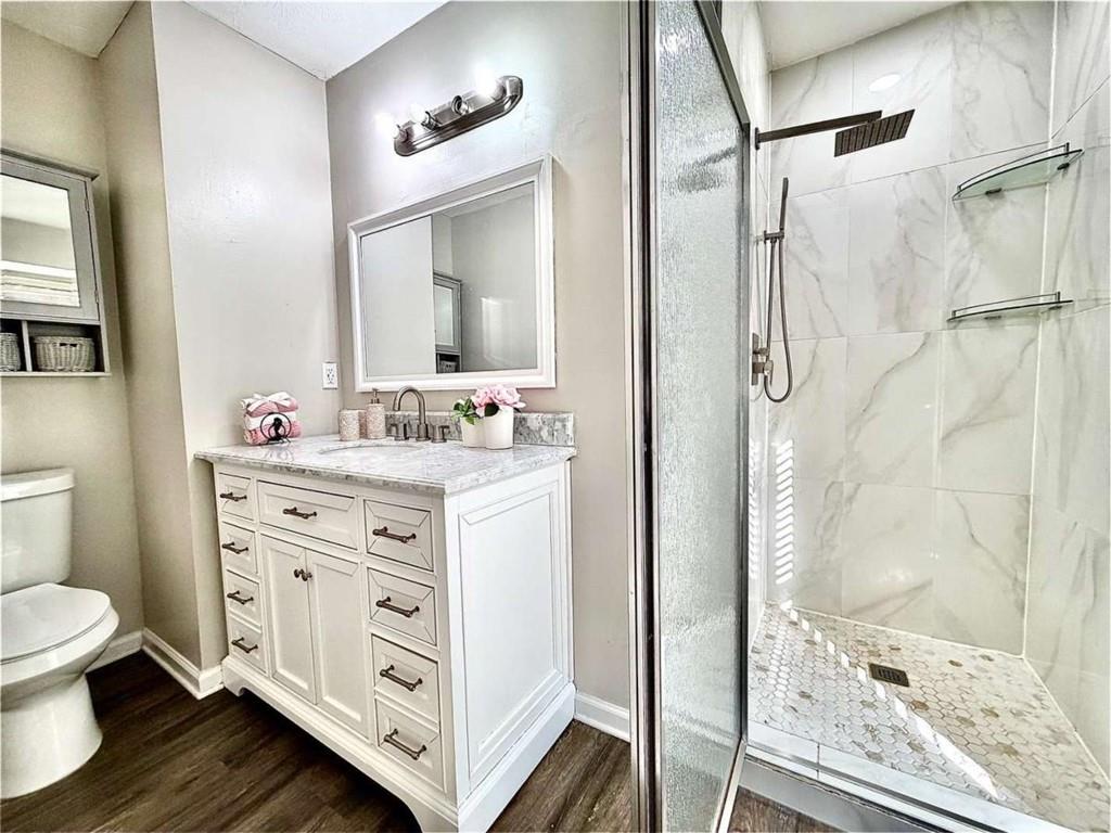 4129 Boxwood Way Duluth, GA 30096 - Photo 22 of 27 a bathroom with a double vanity sink mirror and shower