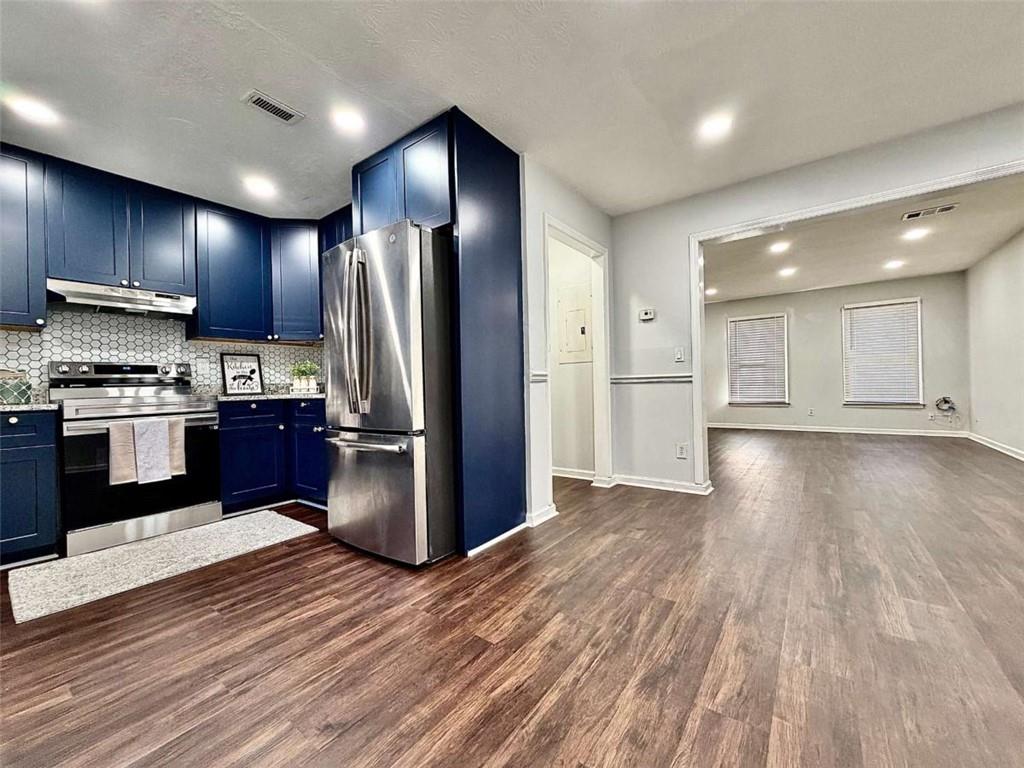 4129 Boxwood Way Duluth, GA 30096 - Photo 10 of 27 a kitchen with stainless steel appliances granite countertop a refrigerator and a stove top oven