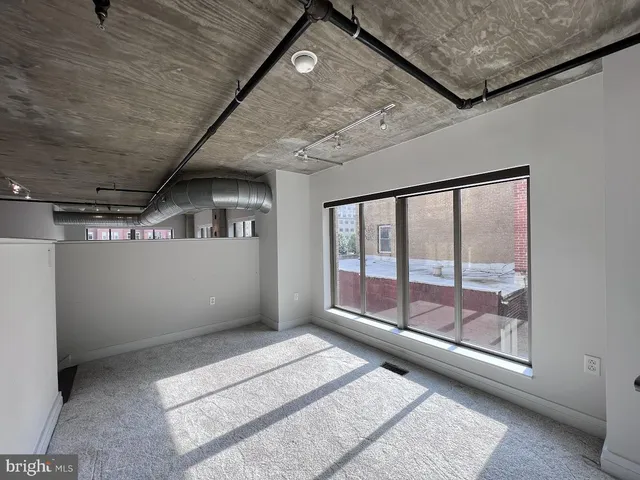 a view of an empty room with a window