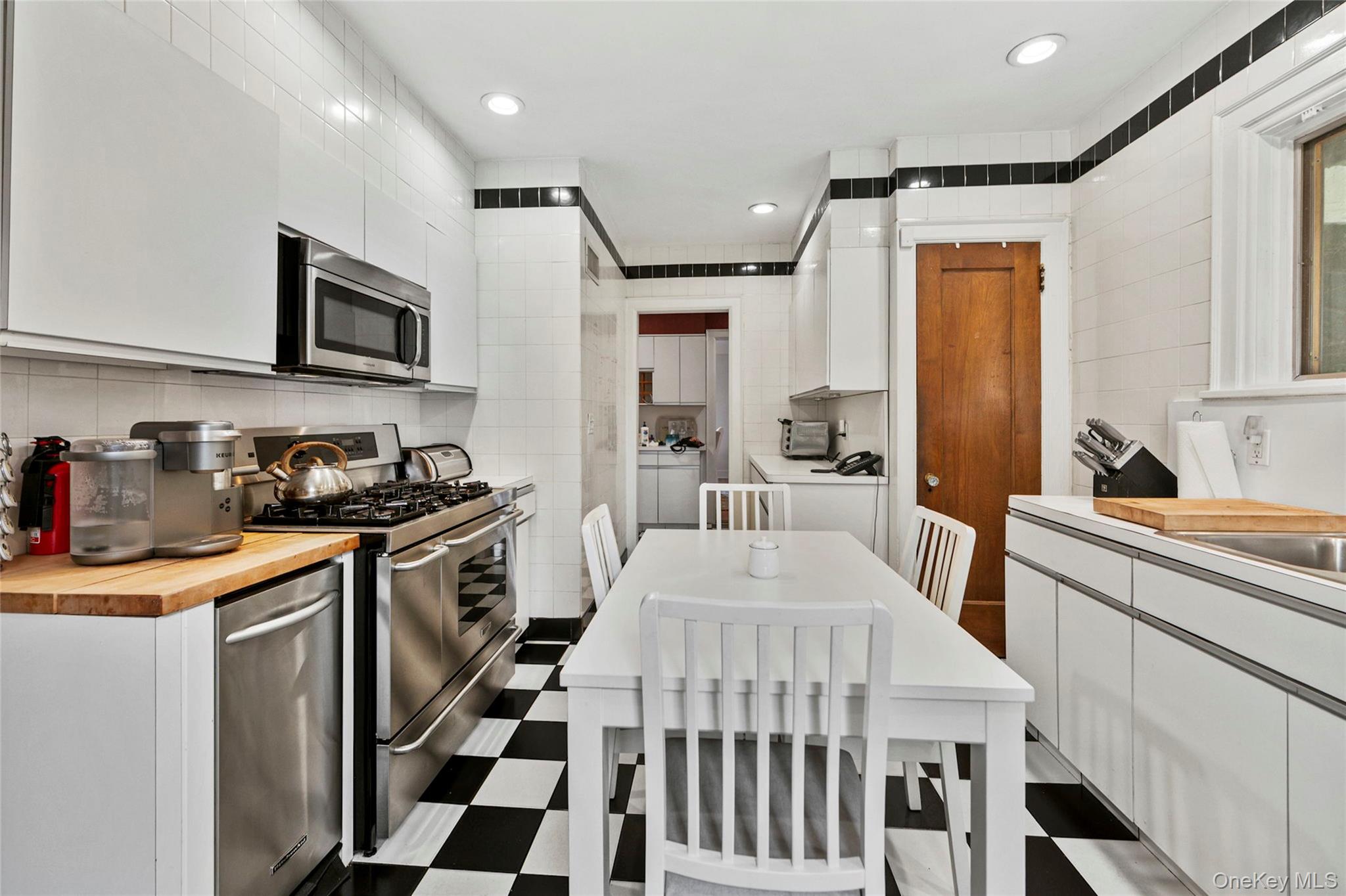 44 Fenimore Road New Rochelle, NY 10804 - Photo 16 of 46 a kitchen with a sink stove and microwave