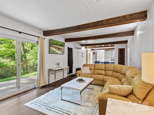 a living room with furniture and a table