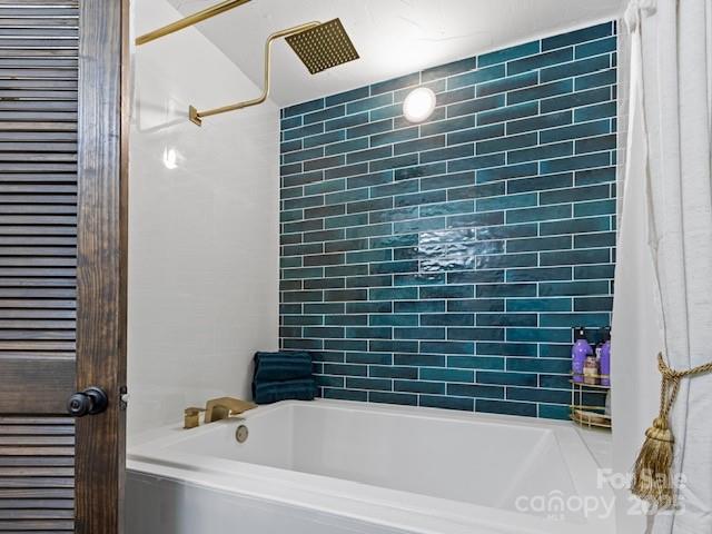 167 Simmons Ridge Road Spruce Pine, NC 28777 - Photo 17 of 44 a bathroom with a bathtub and shower