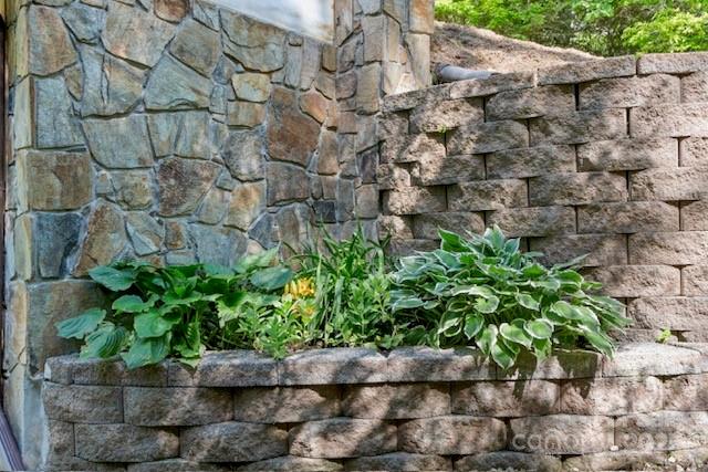 167 Simmons Ridge Road Spruce Pine, NC 28777 - Photo 19 of 44 a plants with wooden fence