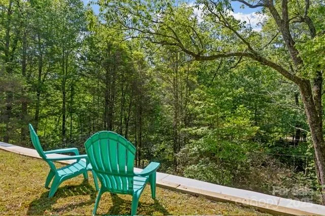 a view of a chairs in a backyard