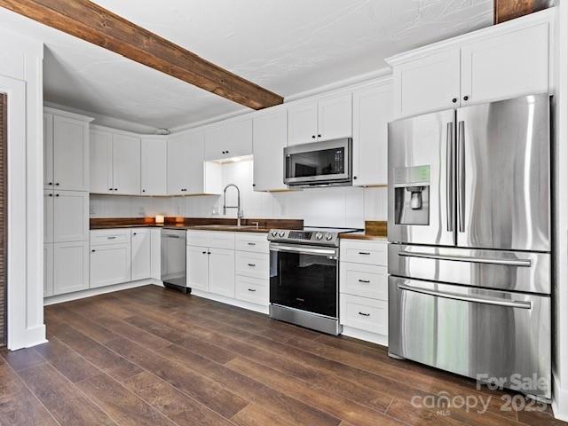 167 Simmons Ridge Road Spruce Pine, NC 28777 - Photo 7 of 44 a kitchen with stainless steel appliances cabinets a microwave and a refrigerator