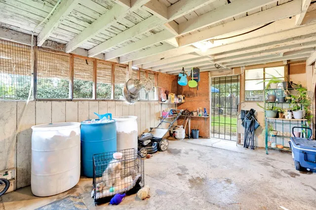 a room with gym equipment and a large window