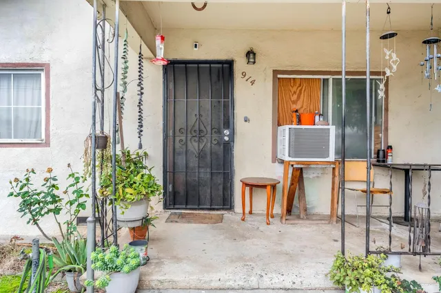 a front view of a house with outdoor seating