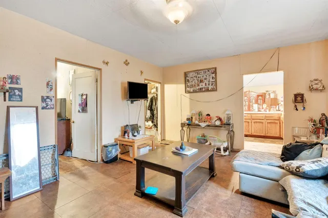 a living room with furniture and a table