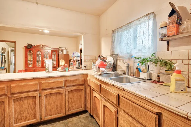 a bathroom with a sink and a window