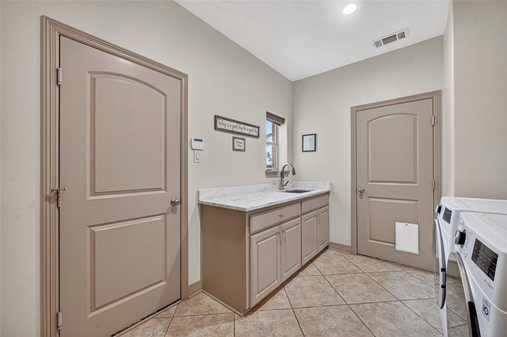 139 Trinity Court Coppell, TX 75019 - Photo 21 of 40 Upstairs, a large game room features a private balcony with breathtaking views.
