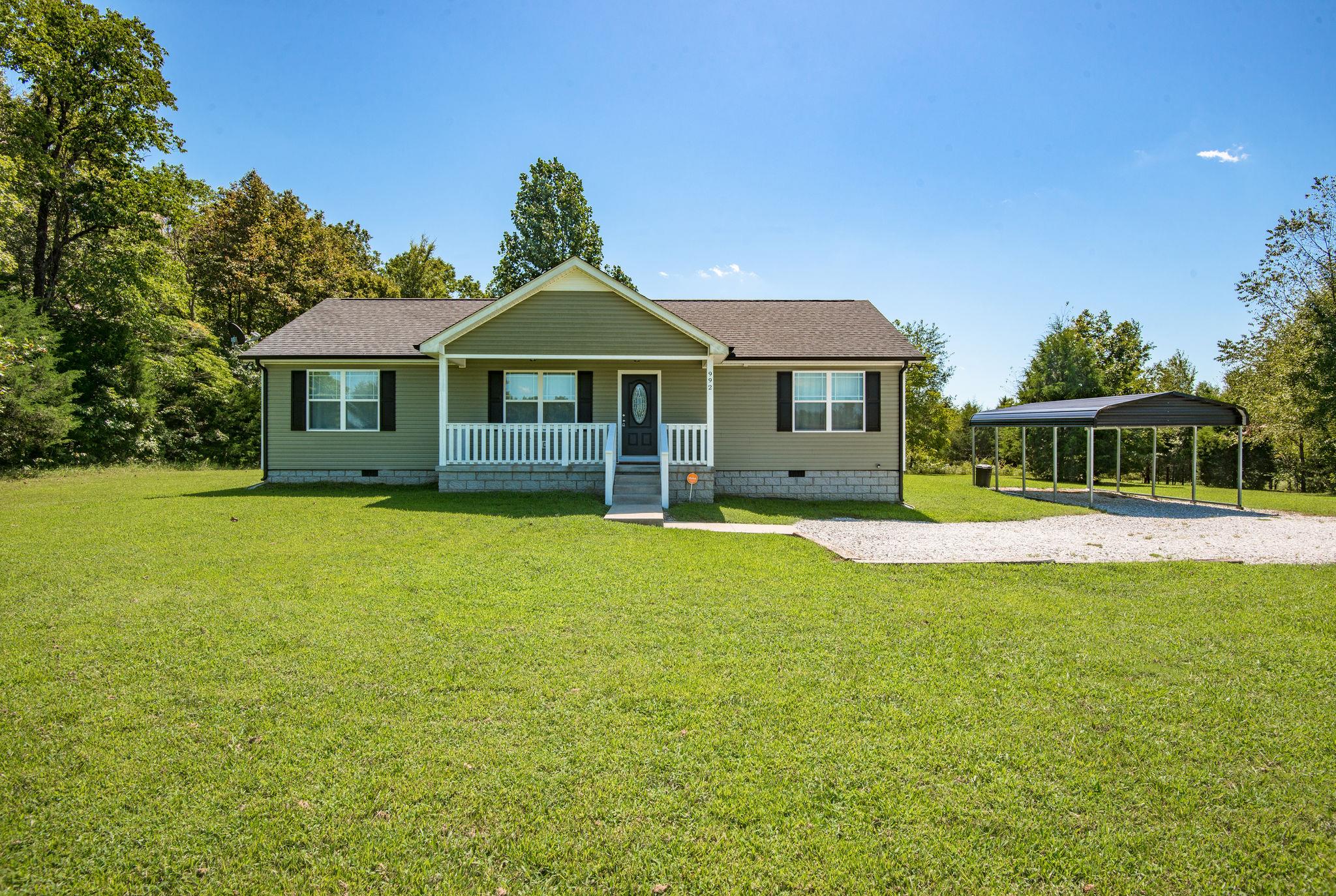 992 Hooper Road Charlotte, TN 37036 - Photo 1 of 27 INCREDIBLE CURB APPEAL!