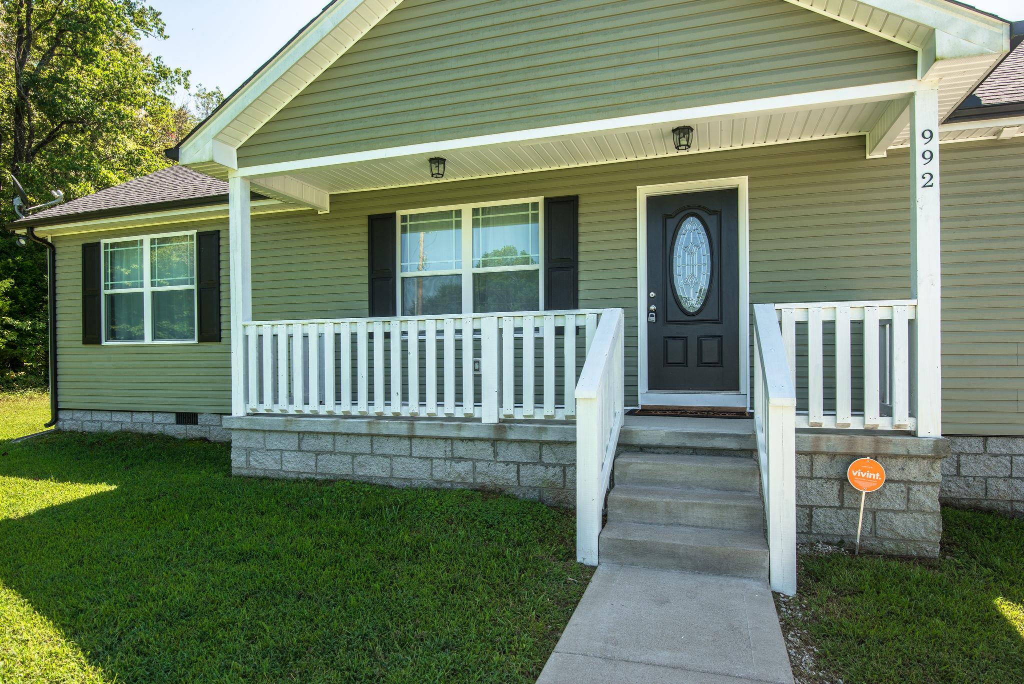 992 Hooper Road Charlotte, TN 37036 - Photo 20 of 27 Covered Front Porch w/ Concrete Walk