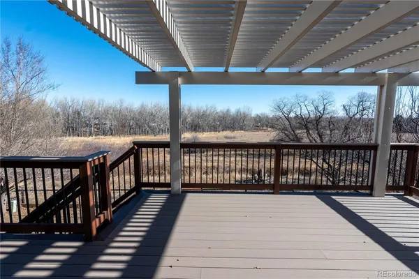 a view of balcony with wooden floor