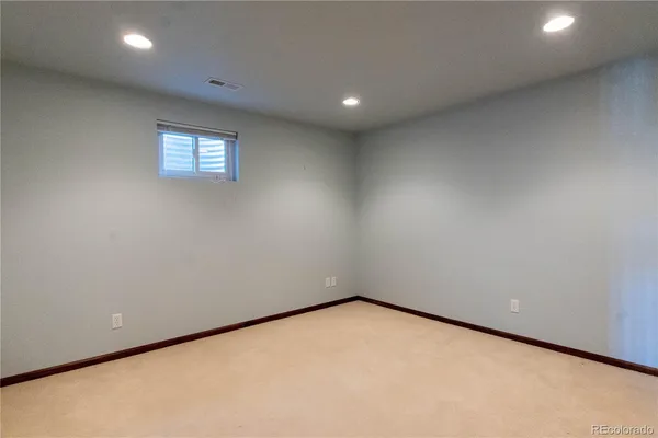 a bathroom with a toilet and shower