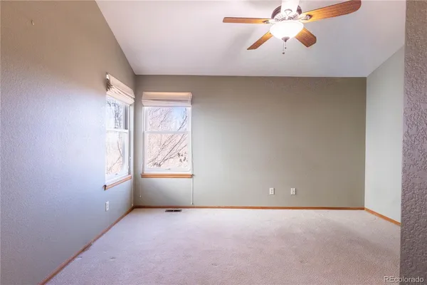 a view of an empty room and a hallway
