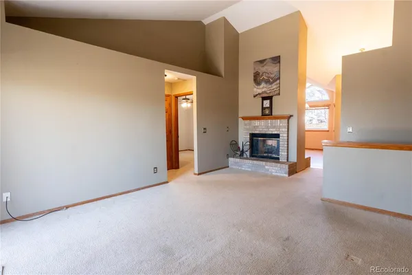 a view of a livingroom with a fireplace