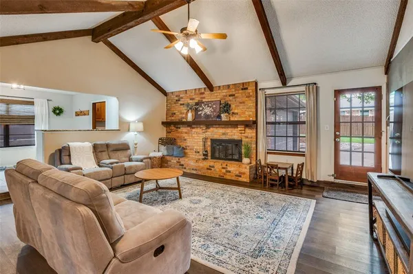 a living room with furniture or couch and a fireplace