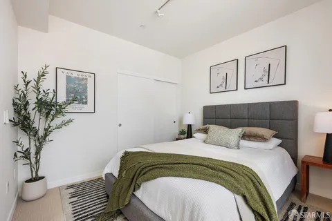a bedroom with a bed and a table in it