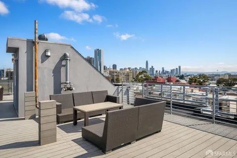 a view of a roof deck with couches