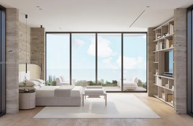 a living room with furniture and large windows