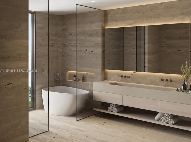 a bathroom with a bathtub and shower